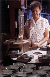 A worker demonstrates ultra-sonic welding.
